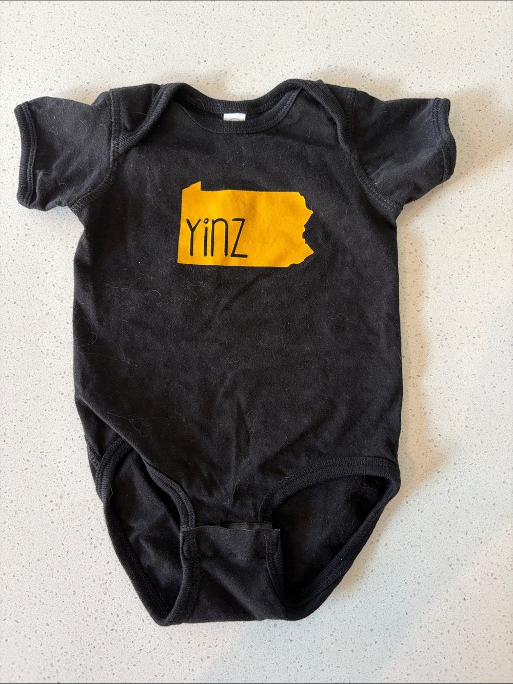 Black 'Yinz' Graphic Baby One-Piece